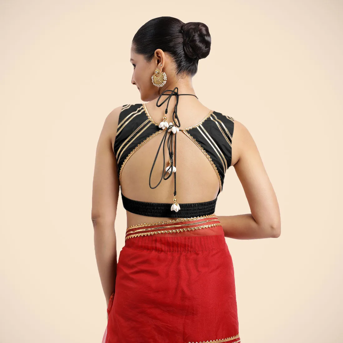 Ahana x Tyohaar | Charcoal Black Sleeveless FlexiFit™ Saree Blouse with Plunging Neckline and Back Cut Out with Tasteful Golden Gota Lace Embellishment